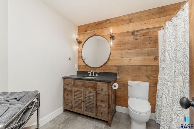 512 E 77th St, Sioux Falls, SD 57108 - bathroom featuring wood walls and vanity