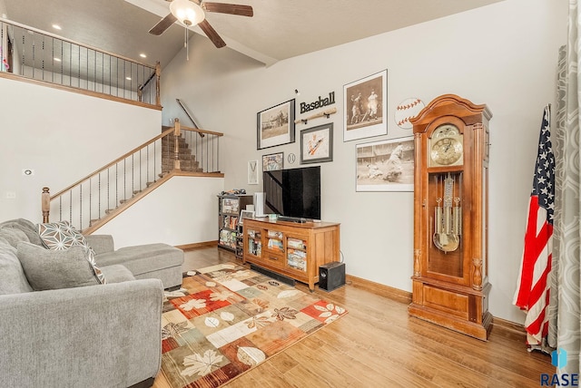 4005 S Grand Slam Ave, Sioux Falls, SD 57110 - living area featuring stairway, wood finished floors, a ceiling fan, and high vaulted ceiling
