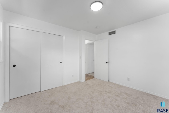 409 S 8th Ave, Brandon, SD 57005 - unfurnished bedroom featuring carpet and a closet