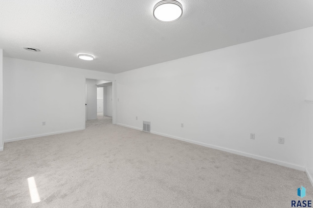 409 S 8th Ave, Brandon, SD 57005 - spare room featuring a textured ceiling and light carpet