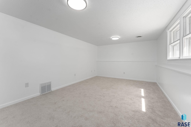 409 S 8th Ave, Brandon, SD 57005 - carpeted spare room featuring a textured ceiling and baseboards