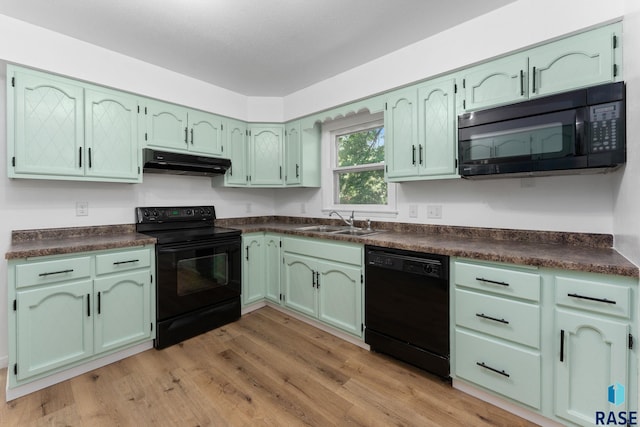 409 S 8th Ave, Brandon, SD 57005 - kitchen featuring black appliances, under cabinet range hood, and green cabinetry