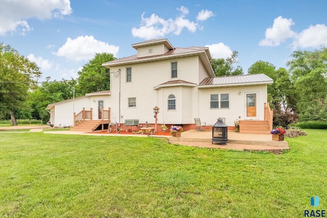 28437 462nd Ave, Davis, SD 57021 - back of house featuring a yard, a patio area, and a metal roof