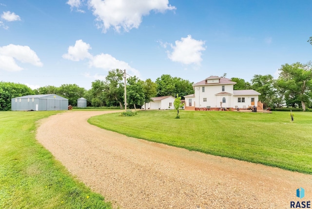 28437 462nd Ave, Davis, SD 57021 - view of front facade featuring a front yard, driveway, an outdoor structure, and a detached garage
