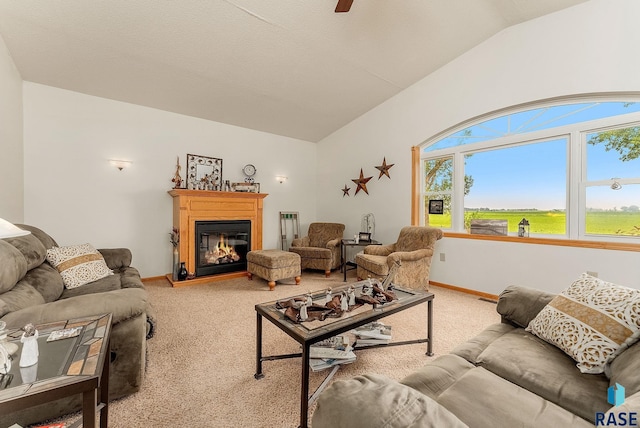 28437 462nd Ave, Davis, SD 57021 - living area featuring lofted ceiling, light carpet, a glass covered fireplace, and a ceiling fan