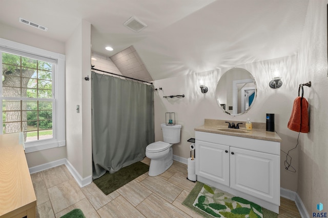 624 S 2nd Ave, Sioux Falls, SD 57104 - full bathroom with vanity, vaulted ceiling, and a shower with shower curtain