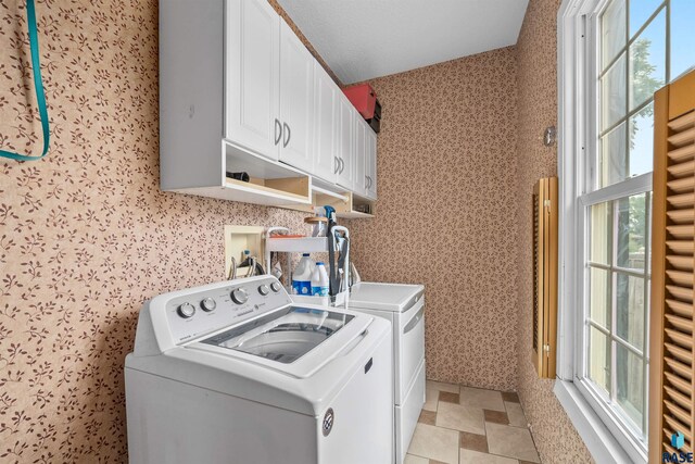 624 S 2nd Ave, Sioux Falls, SD 57104 - laundry area featuring cabinet space, separate washer and dryer, and wallpapered walls