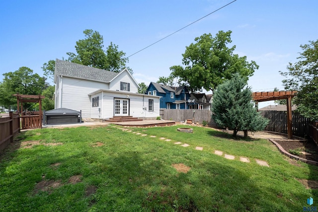 624 S 2nd Ave, Sioux Falls, SD 57104 - back of property with a hot tub, a fenced backyard, french doors, a pergola, and a patio area