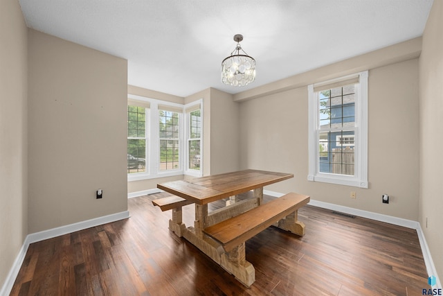 624 S 2nd Ave, Sioux Falls, SD 57104 - dining room featuring dark wood-style floors and a chandelier