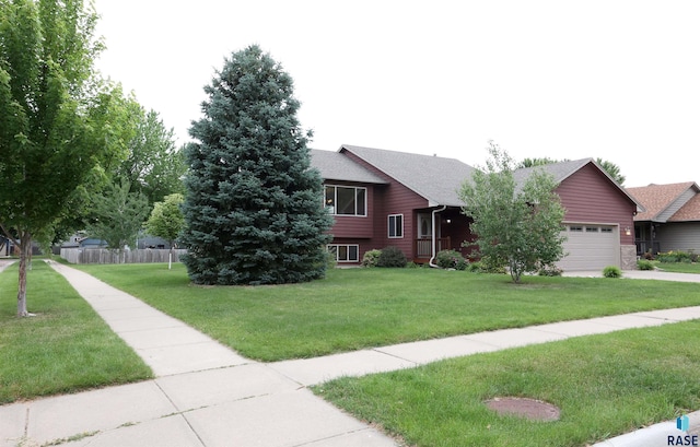 4400 E 38th St, Sioux Falls, SD 57103 - view of front of home with a garage and a shingled roof