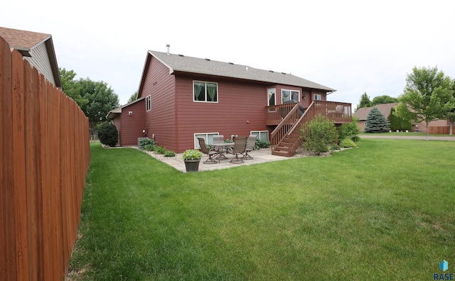 4400 E 38th St, Sioux Falls, SD 57103 - rear view of house featuring a patio, a wooden deck, a yard, and stairs