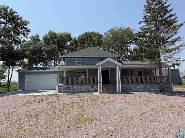 27139 US Highway 81, Freeman, SD 57319 - view of front of house featuring a porch, a garage, and driveway