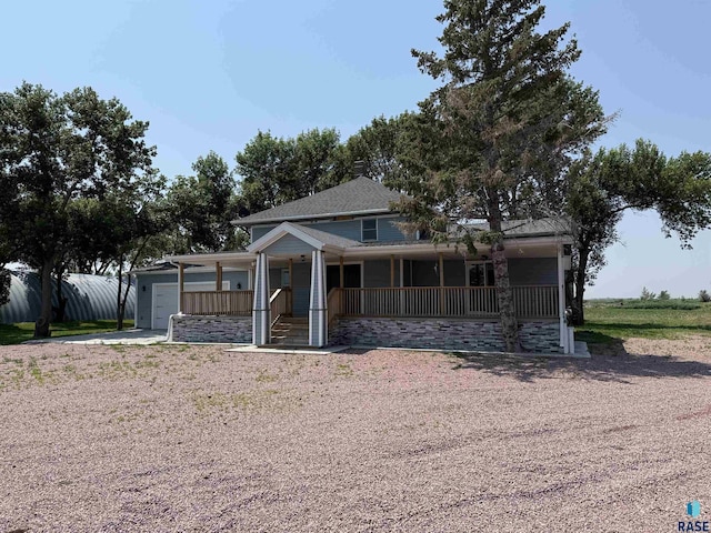 27139 US Highway 81, Freeman, SD 57319 - view of front of home with covered porch, a garage, and concrete driveway