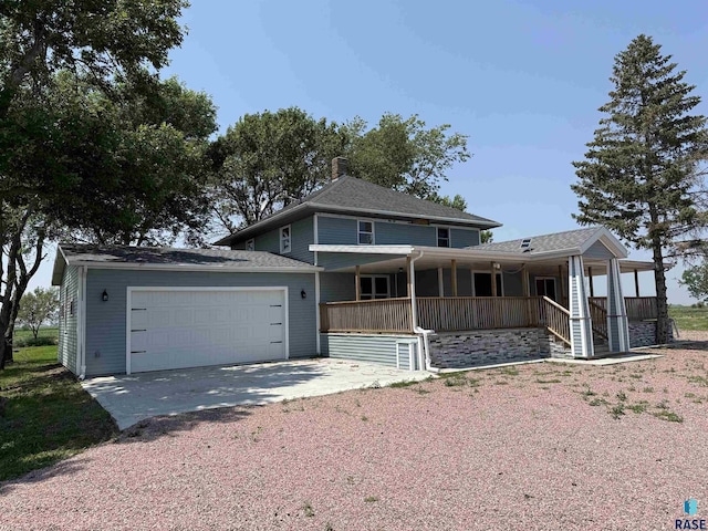 27139 US Highway 81, Freeman, SD 57319 - view of front facade featuring covered porch, gravel driveway, and an attached garage