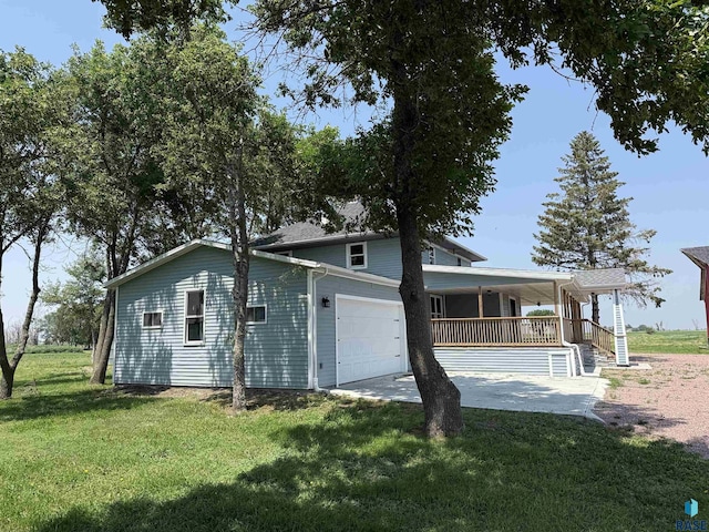 27139 US Highway 81, Freeman, SD 57319 - view of side of property featuring a yard, covered porch, a garage, and driveway