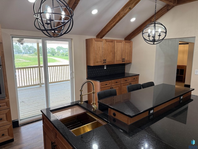 27139 US Highway 81, Freeman, SD 57319 - kitchen with a chandelier, recessed lighting, pendant lighting, decorative backsplash, and wood finished floors