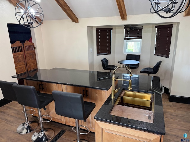 27139 US Highway 81, Freeman, SD 57319 - bar area with a chandelier, beam ceiling, and dark wood-style flooring