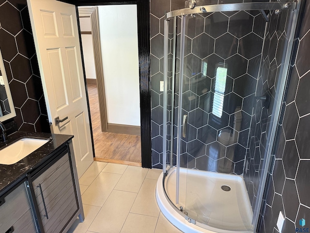 27139 US Highway 81, Freeman, SD 57319 - bathroom featuring a shower stall, vanity, and tile patterned flooring
