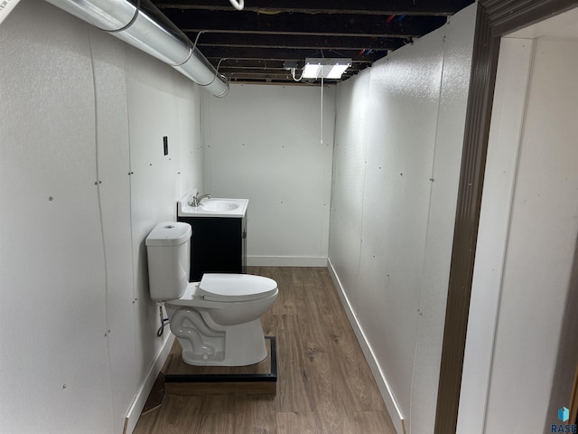 27139 US Highway 81, Freeman, SD 57319 - half bathroom with wood finished floors and vanity