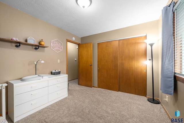 4504 S Plains Dr, Sioux Falls, SD 57106 - bedroom featuring light colored carpet and a closet