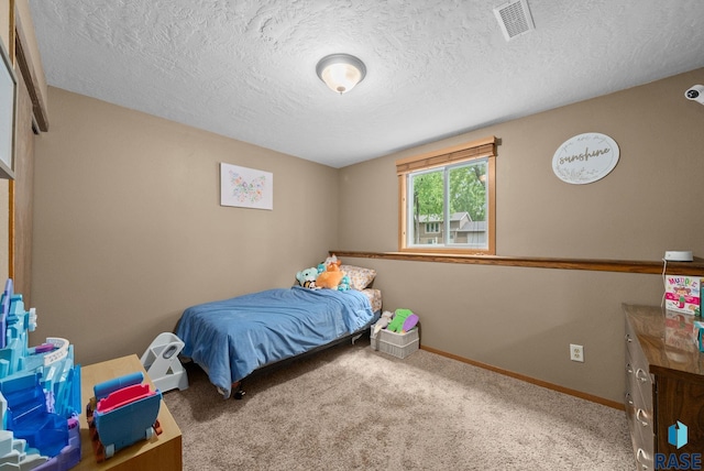4504 S Plains Dr, Sioux Falls, SD 57106 - carpeted bedroom featuring a textured ceiling
