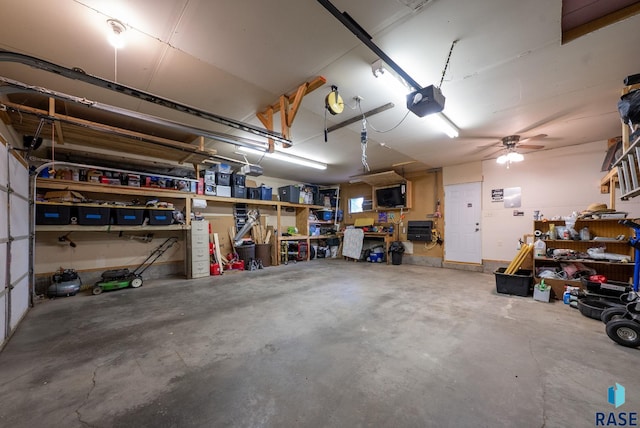 4504 S Plains Dr, Sioux Falls, SD 57106 - garage featuring a workshop area and a garage door opener