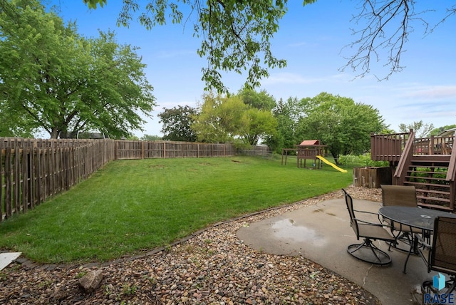4504 S Plains Dr, Sioux Falls, SD 57106 - fenced backyard featuring a playground, a patio area, a deck, and stairway