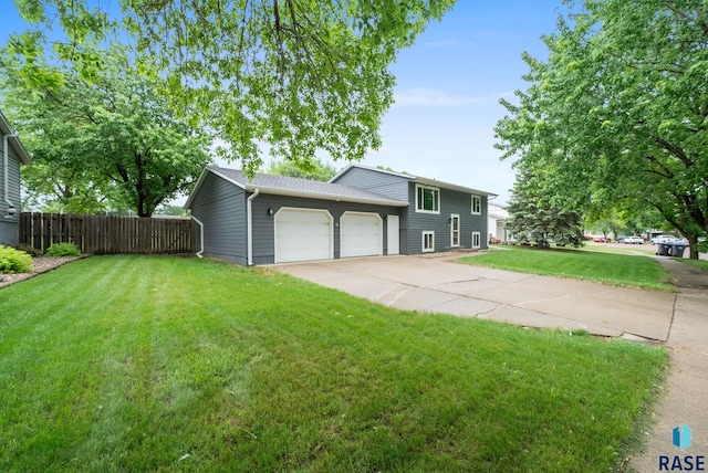 4504 S Plains Dr, Sioux Falls, SD 57106 - split level home featuring a garage and concrete driveway
