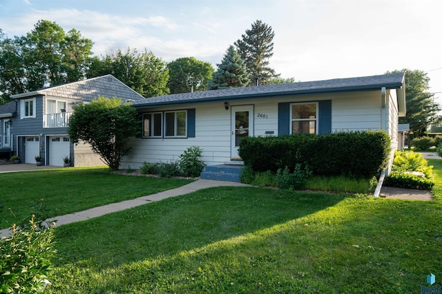 2601 S Glendale Ave, Sioux Falls, SD 57105 - ranch-style home with a front lawn, an attached garage, and driveway