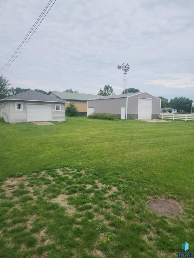 140 Trosky Rd, Edgerton, MN 56128 - view of yard featuring an outbuilding, a detached garage, and a pole building