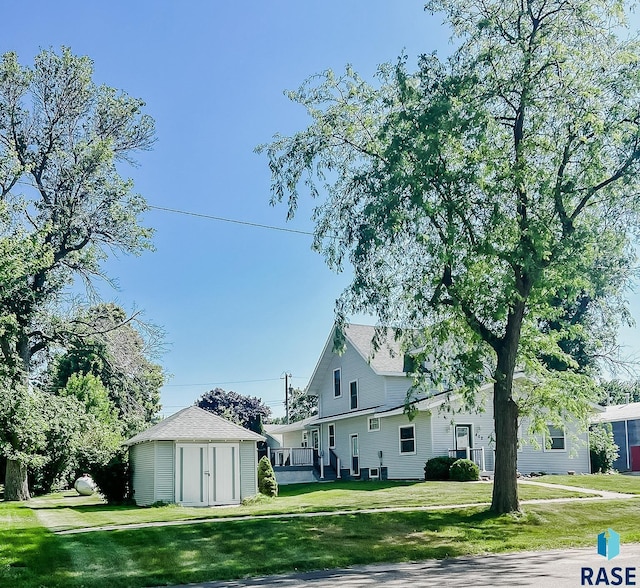 402 E 1st Ave, Beaver Creek, MN 56116 - back of property featuring a storage unit and a yard