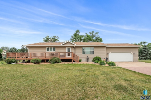 705 Railway St, Canistota, SD 57012 - ranch-style house with a garage, concrete driveway, a front yard, and a deck