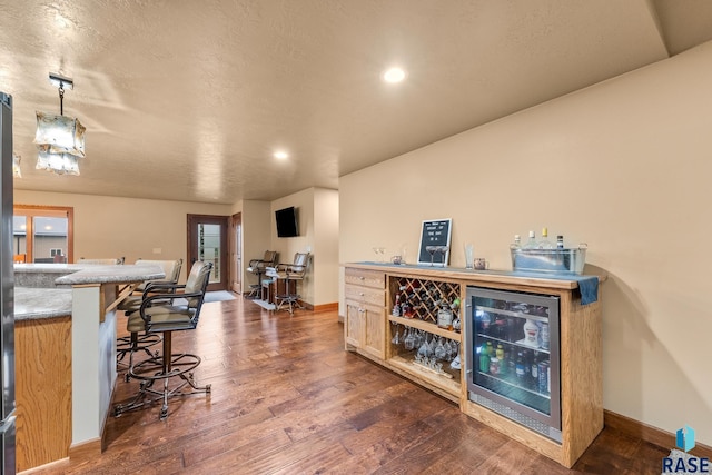 705 Railway St, Canistota, SD 57012 - indoor dry bar with wine cooler, dark wood finished floors, and recessed lighting