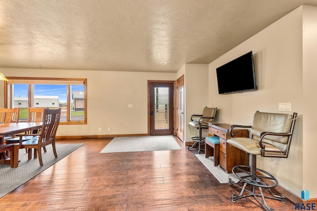 705 Railway St, Canistota, SD 57012 - dining room featuring hardwood / wood-style flooring and a textured ceiling