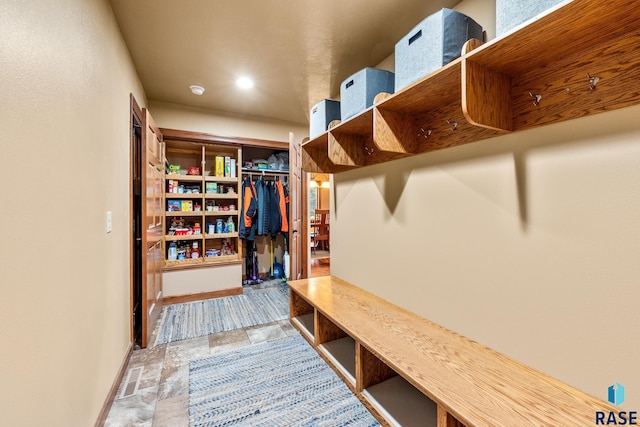 705 Railway St, Canistota, SD 57012 - mudroom featuring baseboards and stone finish flooring