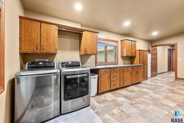 705 Railway St, Canistota, SD 57012 - laundry room featuring cabinet space, washer and dryer, recessed lighting, and light stone finish flooring