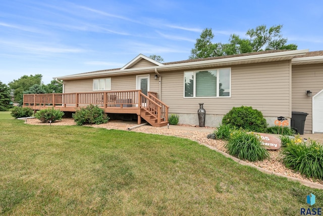 705 Railway St, Canistota, SD 57012 - view of front facade featuring a deck and a front lawn