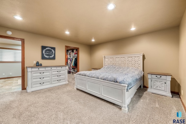 705 Railway St, Canistota, SD 57012 - bedroom with light colored carpet, a walk in closet, recessed lighting, and a closet