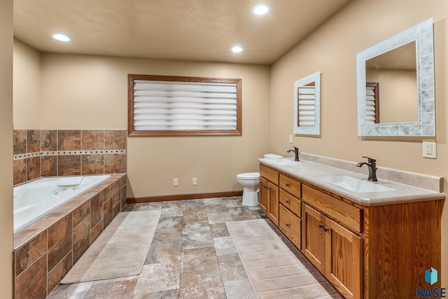 705 Railway St, Canistota, SD 57012 - full bathroom with double vanity, a bath, stone finish flooring, and recessed lighting
