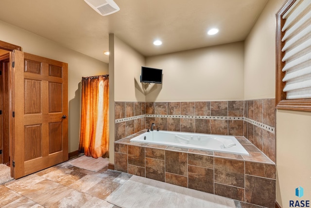 705 Railway St, Canistota, SD 57012 - bathroom with a bath and recessed lighting