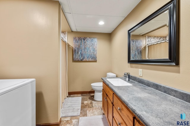 705 Railway St, Canistota, SD 57012 - bathroom featuring vanity, stone finish floors, washer / clothes dryer, and curtained shower