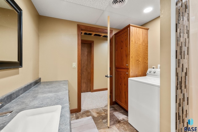 705 Railway St, Canistota, SD 57012 - laundry area with washer / clothes dryer and stone finish flooring