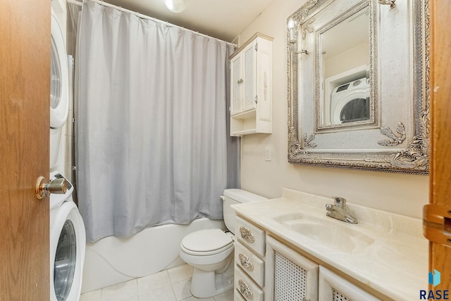 612 E 26th St, Sioux Falls, SD 57105 - bathroom with stacked washing machine and dryer, vanity, shower / bath combo, and tile patterned flooring