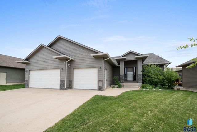 601 W Highpointe St, Tea, SD 57064 - craftsman house with a garage, concrete driveway, a front yard, and stone siding