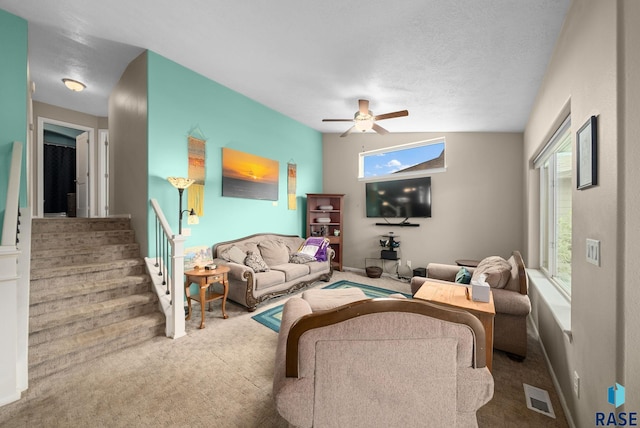 601 W Highpointe St, Tea, SD 57064 - living area featuring carpet, ceiling fan, healthy amount of natural light, and stairway