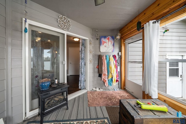601 W Highpointe St, Tea, SD 57064 - mudroom featuring a wood stove and wooden walls