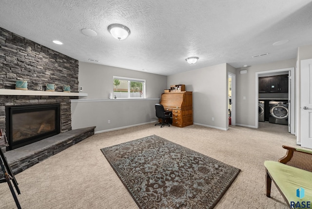 601 W Highpointe St, Tea, SD 57064 - living area with washer and clothes dryer, carpet floors, a fireplace, and a textured ceiling