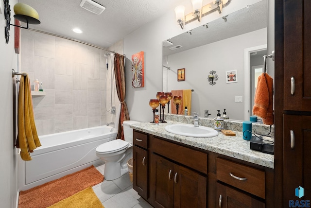 601 W Highpointe St, Tea, SD 57064 - bathroom with vanity, tile patterned flooring, shower / tub combo, and a textured ceiling