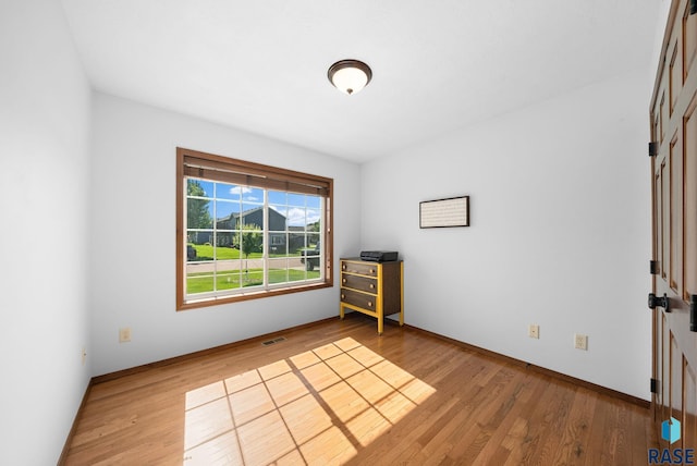 1413 Holbrook Ave, Sioux Falls, SD 57107 - empty room featuring wood finished floors and baseboards