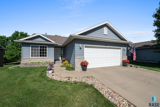 1413 Holbrook Ave, Sioux Falls, SD 57107 - single story home featuring a front yard, concrete driveway, brick siding, and a garage